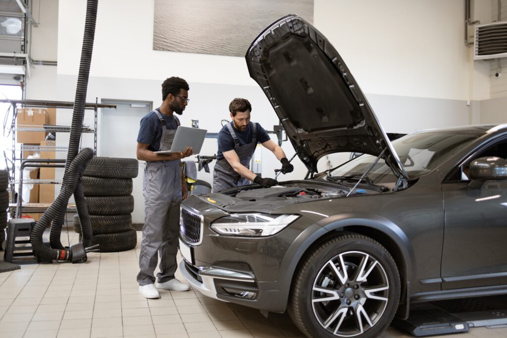 Mechanics working on car maintenance