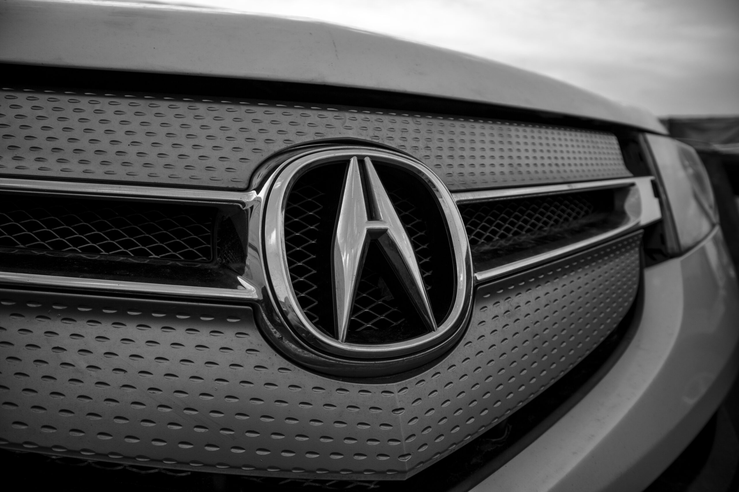 Acura logo on the front of the car