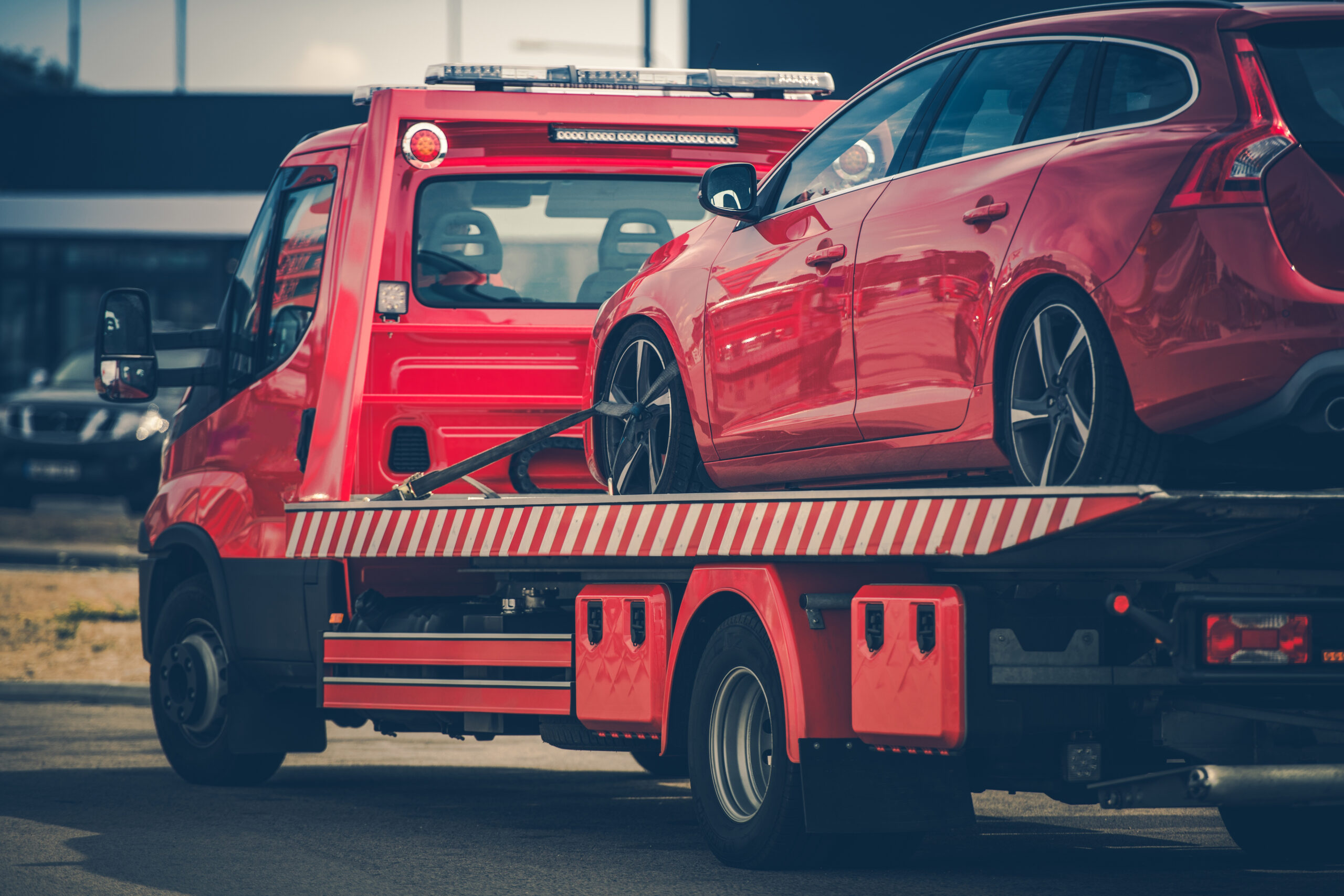 Car on a Red Towing Truck