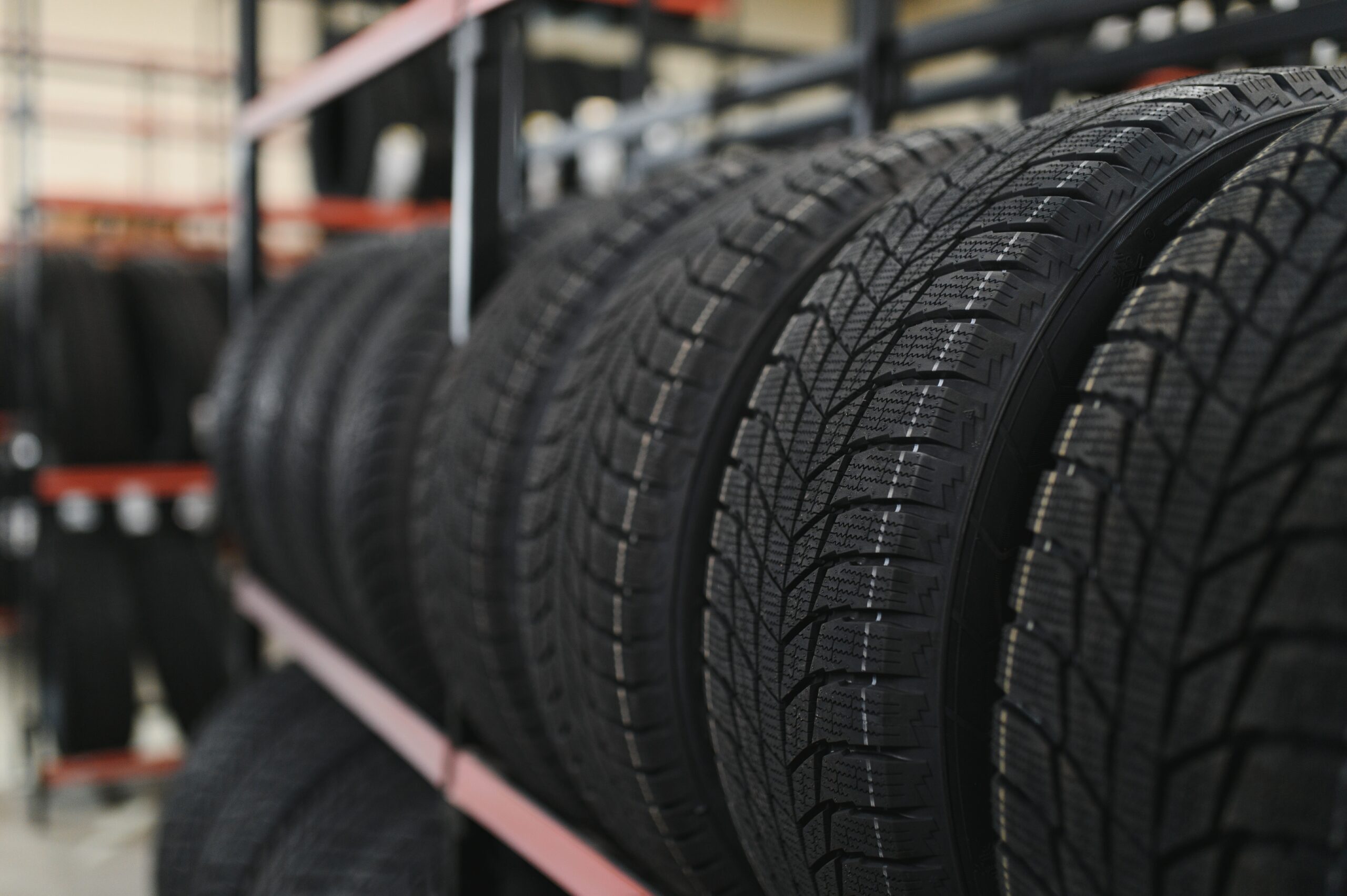 New car tire on a tire storage rack