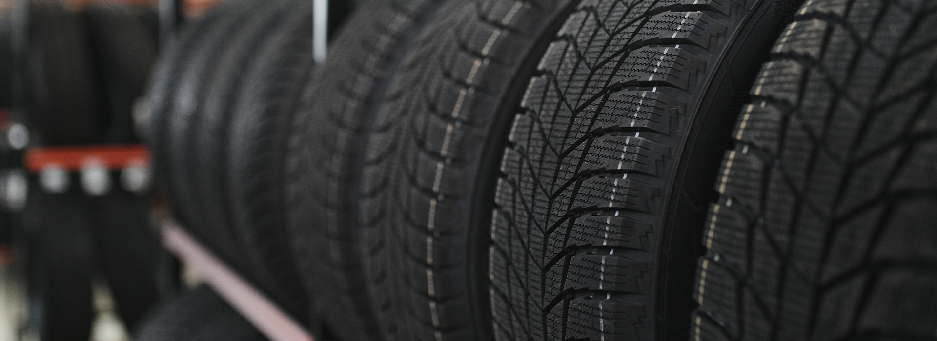 New car tire on a tire storage rack
