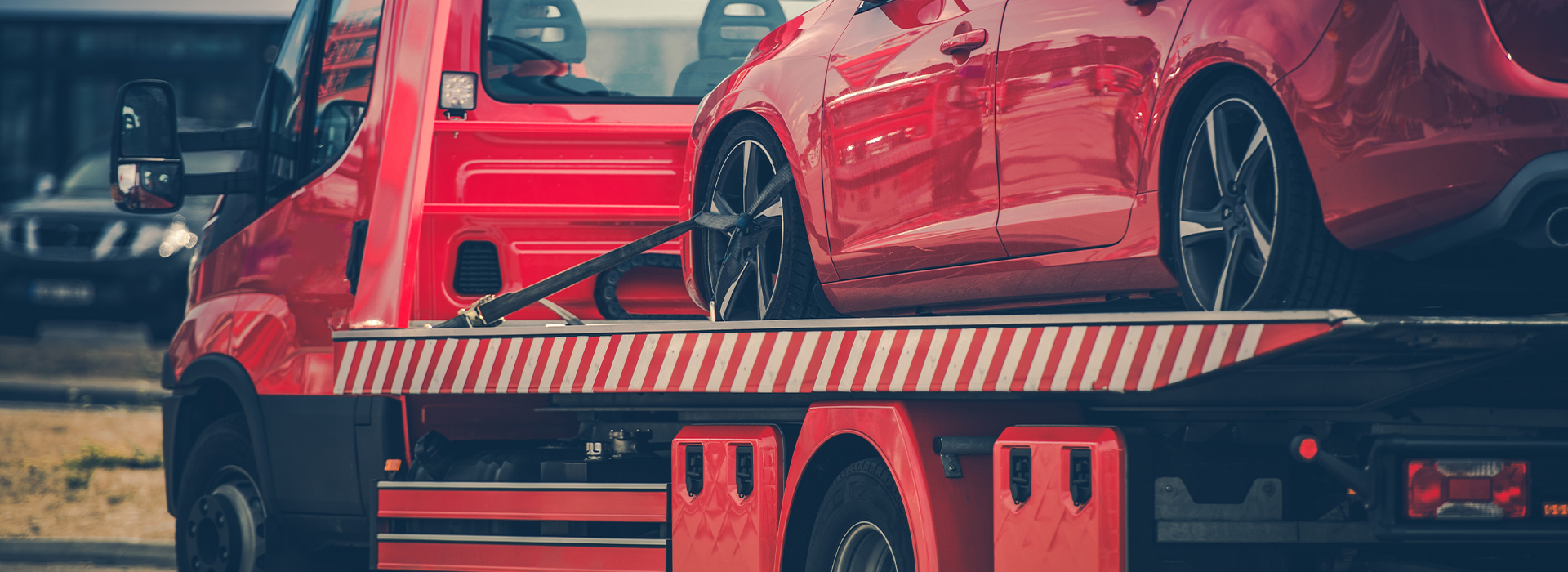 Car on a Red Towing Truck