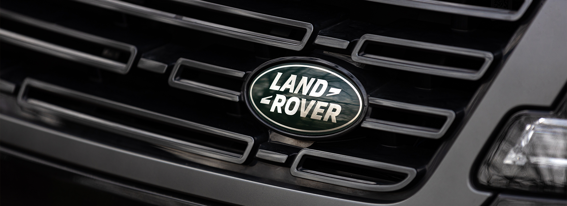 Land Rover logo on the front of an SUV