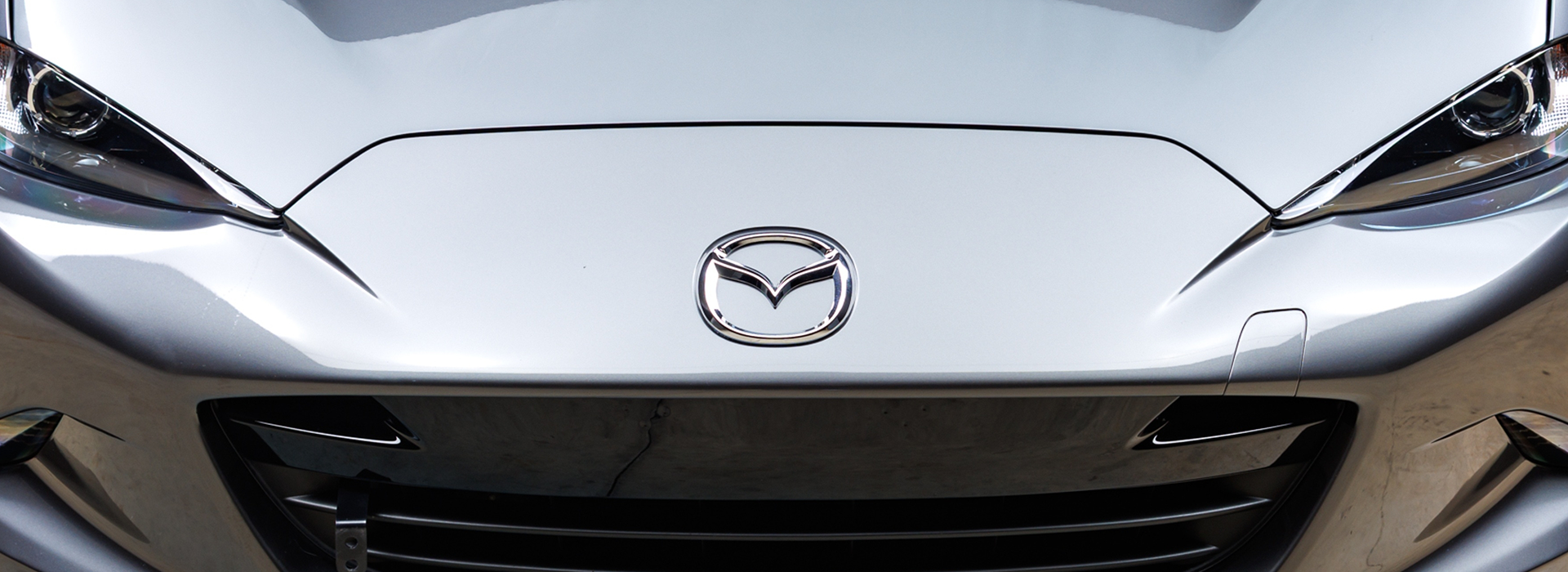 Mazda logo on the front of a car