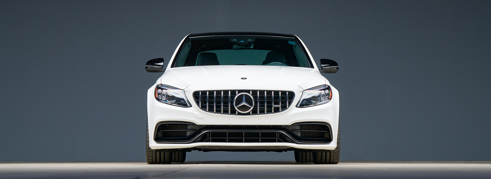 Mercedes logo on the front of a car