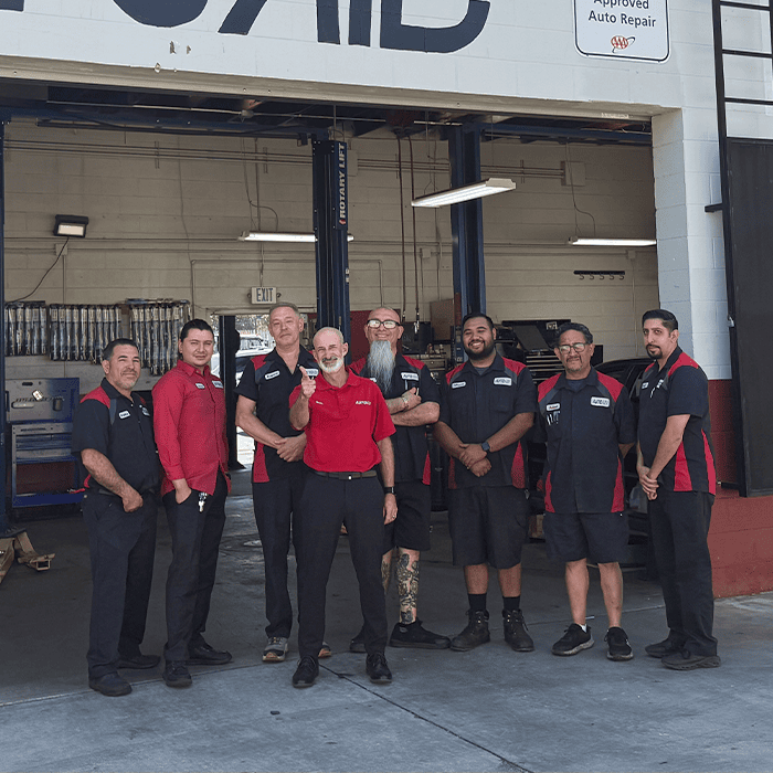 AutoAid team in front of the AutoAid shop